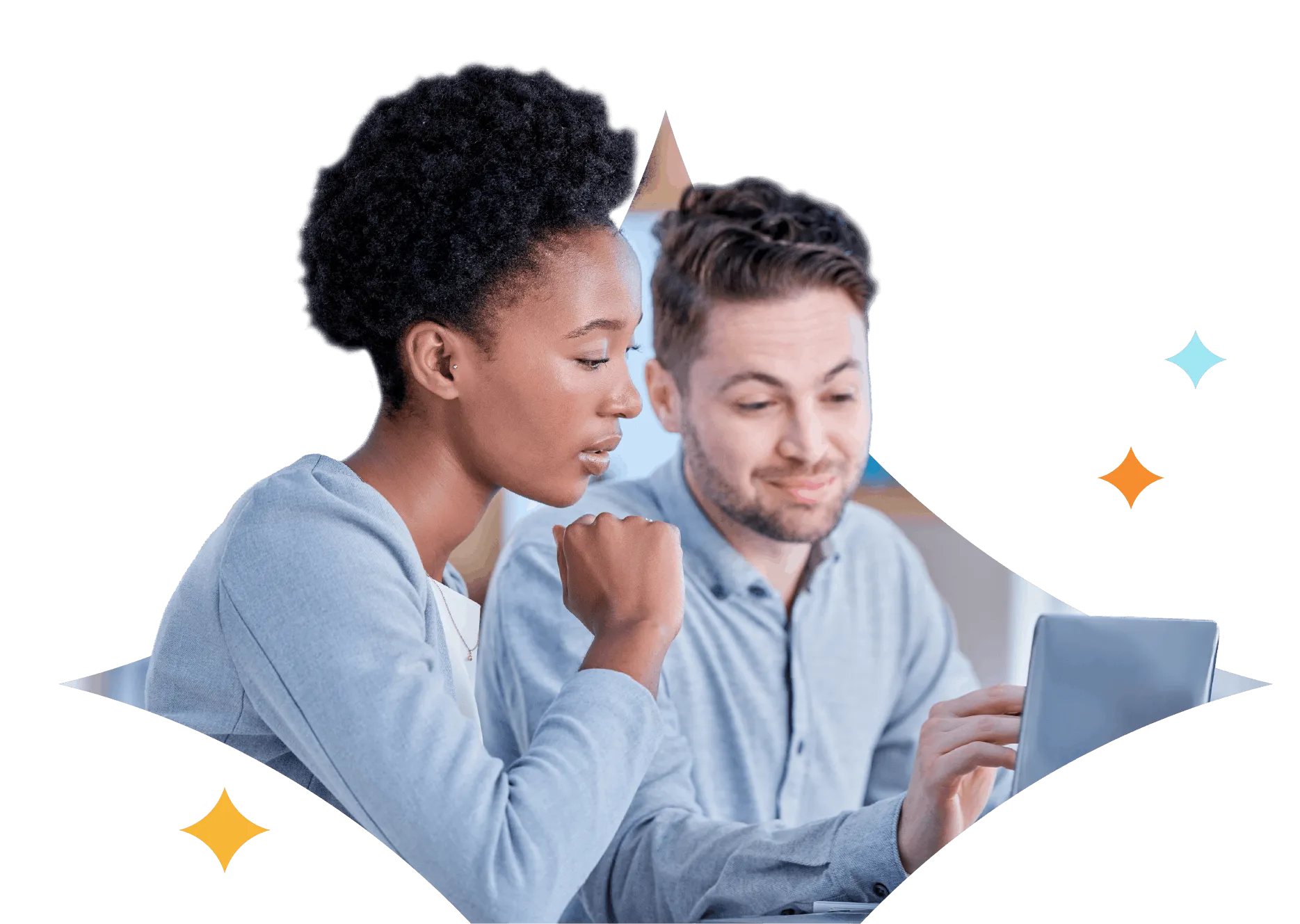 Two colleagues looking at a laptop screen, engaged in discussion.