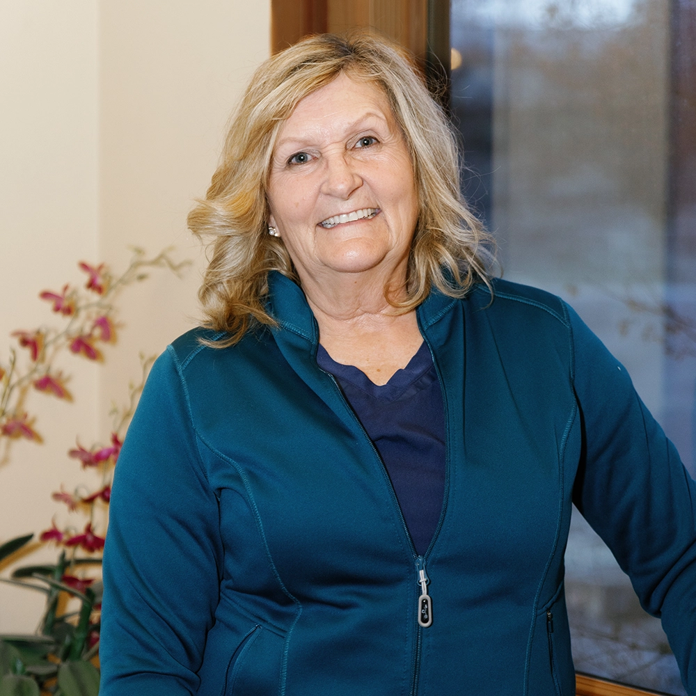 Janice Bade, Caucasian middle aged female with blonde hair and blue eyes