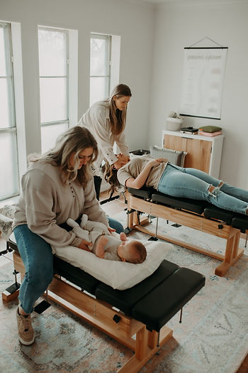 Family getting a chiropractic adjustment in Keller, Texas