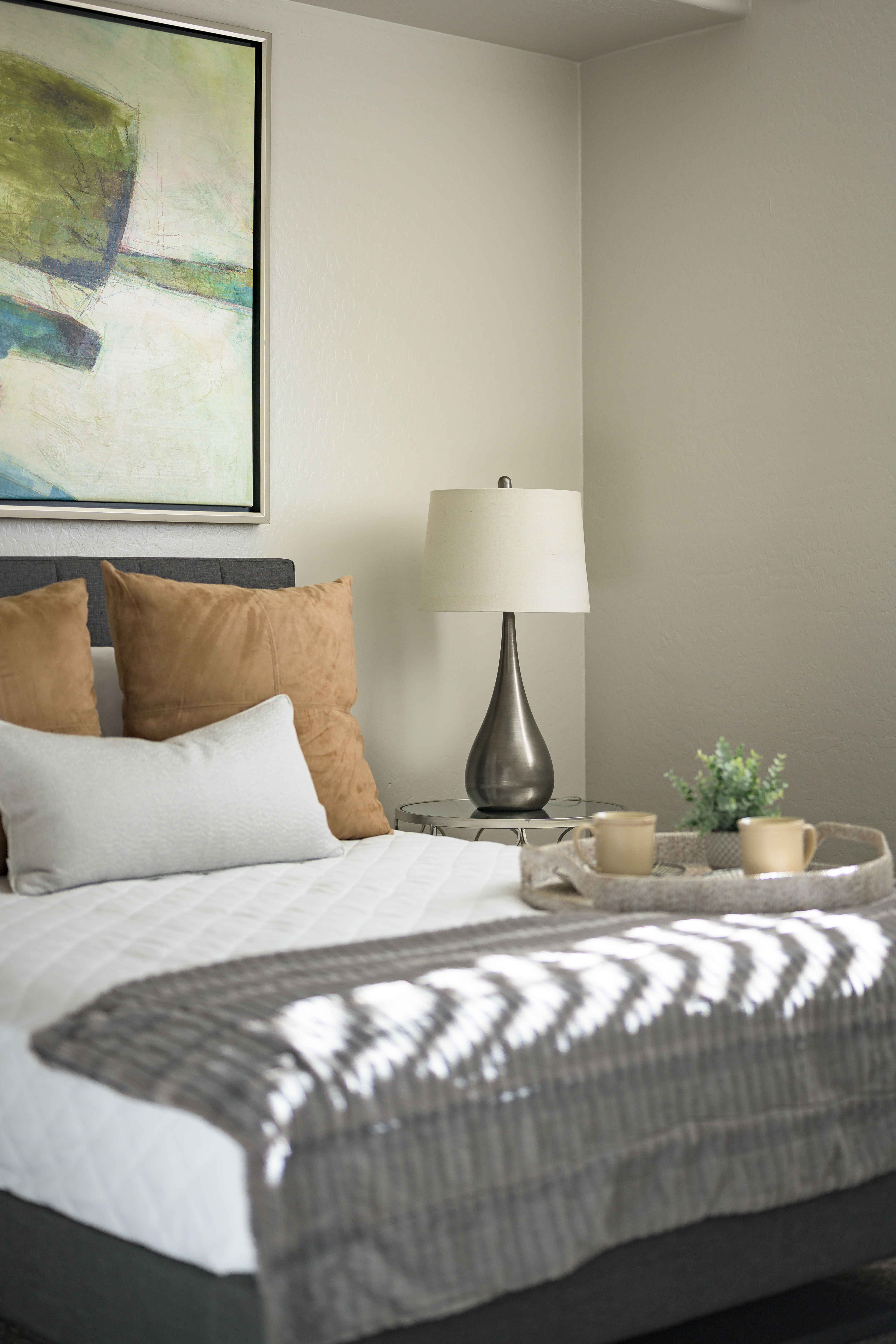 Bedroom with bed, modern art and decor