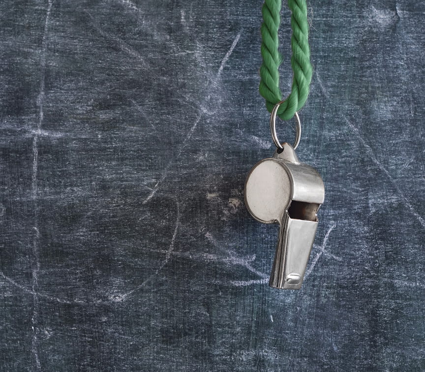 Chalkboard with whistle hanging on it