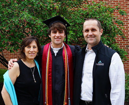Bart Newman with his wife at his son's graduation