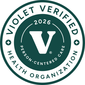 Violet Verified Health Organization seal with 2026 and person-centered care text around a large V.