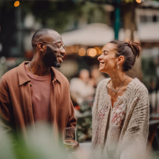 Couple Smiling at each other 