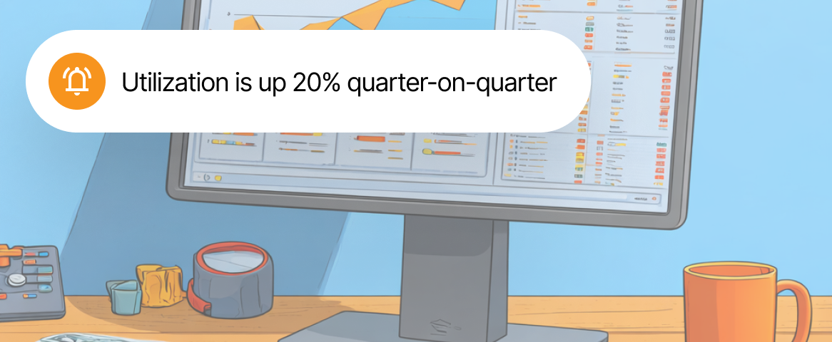 Notification icon next to text stating utilization is up 20% quarter-on-quarter, displayed above a computer monitor showing charts and a desk with office items.
