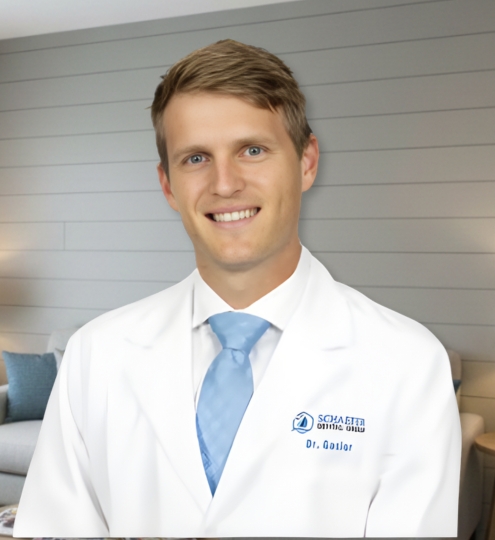 Dr. Andrew Gasior, lead dentist at Gasior Family Dental in Northville, MI, is pictured in a professional portrait wearing a white lab coat and tie. His confident yet approachable smile reflects a dedication to high-quality family dentistry, advanced clinical care, and building long-term relationships with patients of all ages in the Northville community.