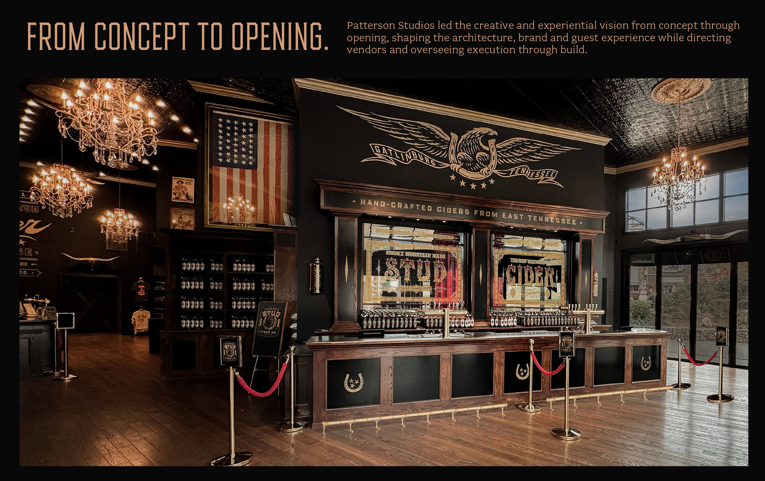 Interior of a rustic cider bar with a long wooden counter, multiple taps, stained glass windows reading 'Stud Cider,' chandeliers, an American flag, and dark decorative walls featuring a large eagle emblem with 'Gatlinburg Tennessee.'
