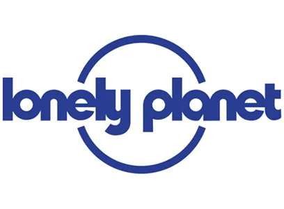 Lonely Planet travel brand logo with a partial circle around the text in dark blue.