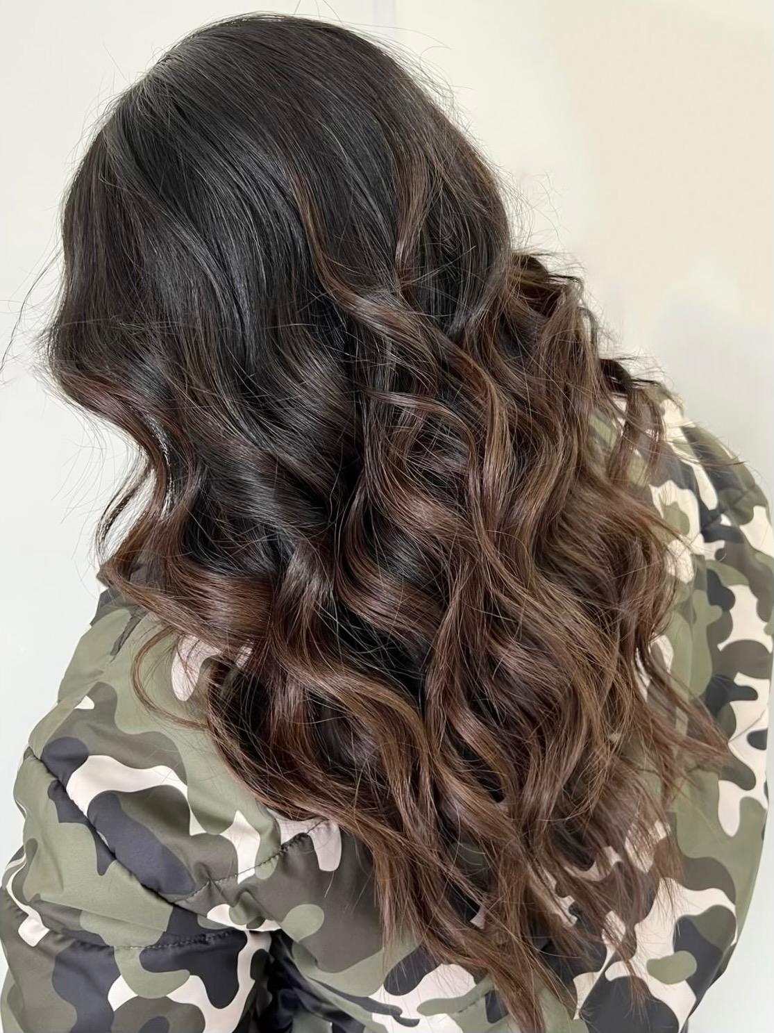 Portrait of a young woman with wavy brown hair