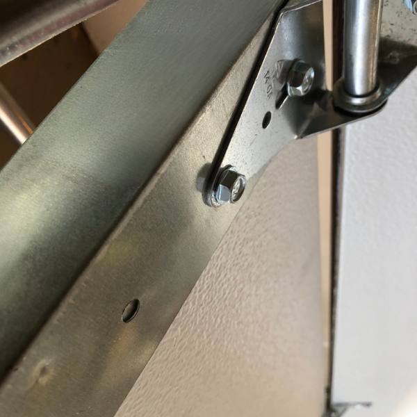 Zoomed in photo of the back of a garage door opening
