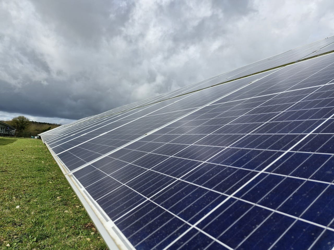 image of a team brainstorming around a digital whiteboard