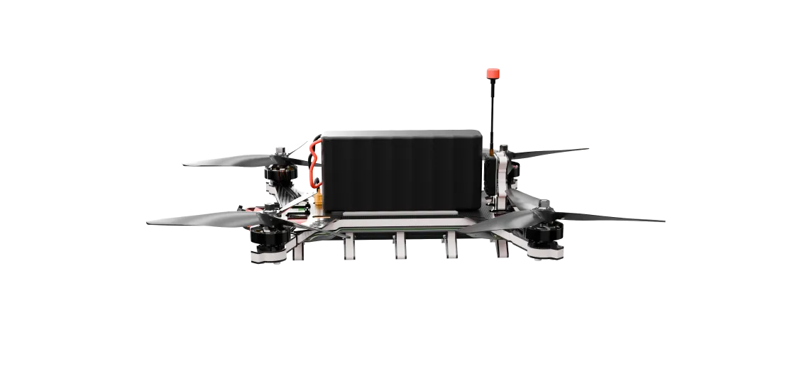 Front view of a quadcopter drone with four propellers, a central black battery, and an antenna with a red tip.