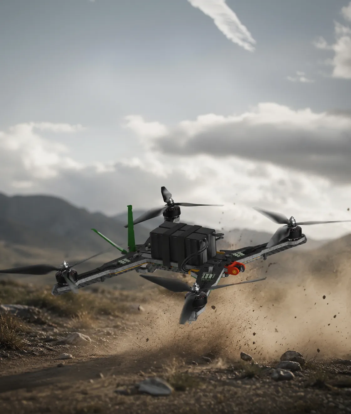 Quadcopter drone flying low over rocky dirt terrain with dust and debris kicking up behind it.