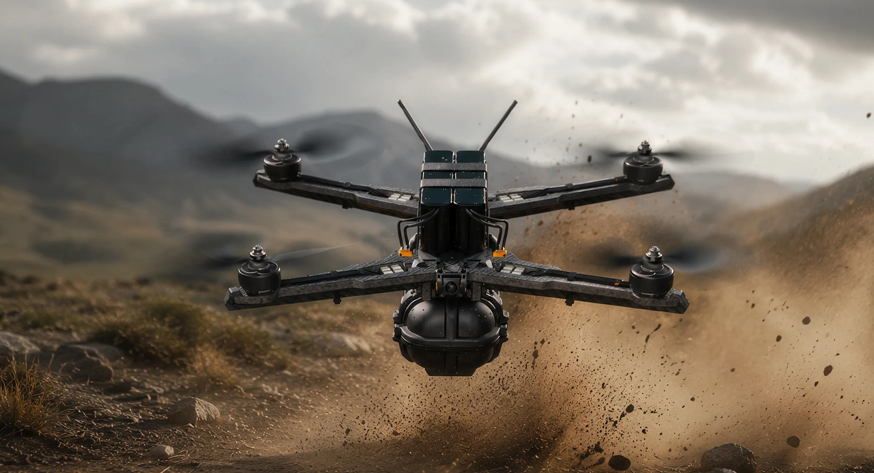 Black quadcopter drone flying over a grassy field with blurred trees in the background.