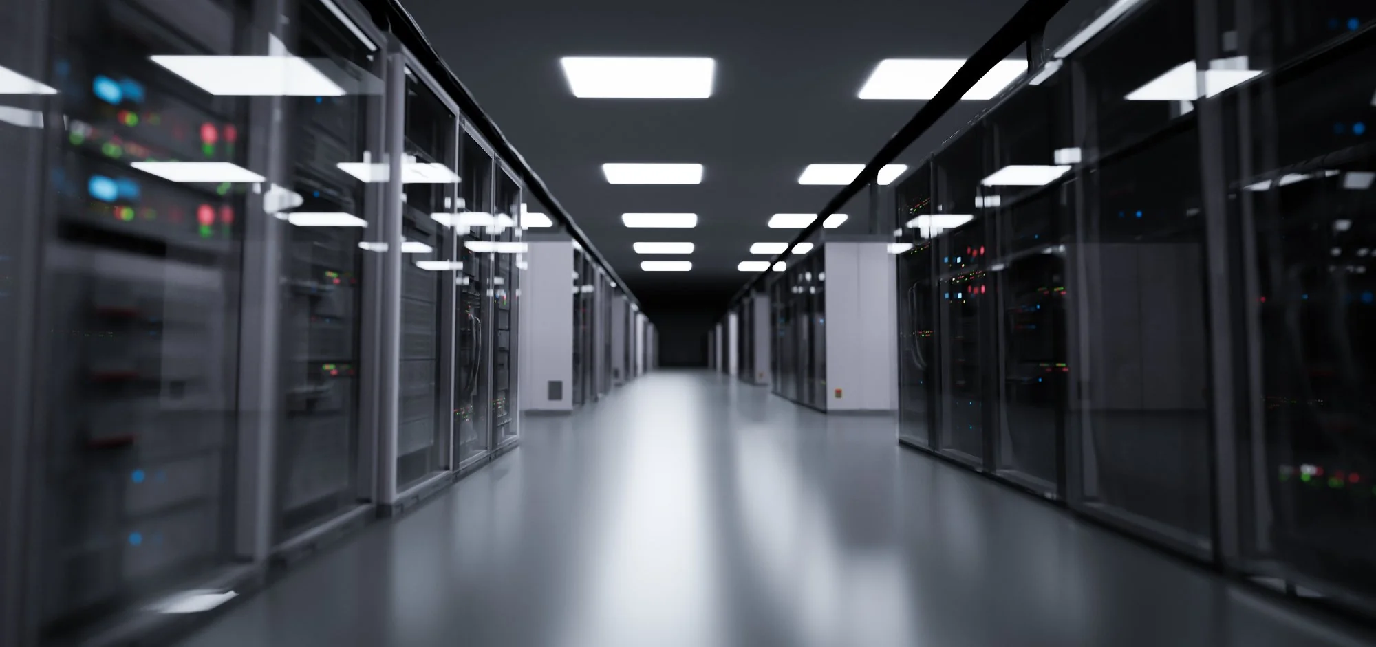 Modern data centre corridor with rows of server racks, representing the IT infrastructure that requires compliant ITAD and secure data destruction when decommissioned