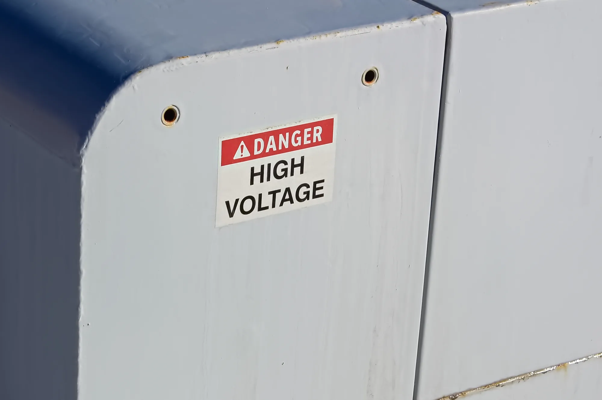 High voltage danger sign on a battery energy storage enclosure