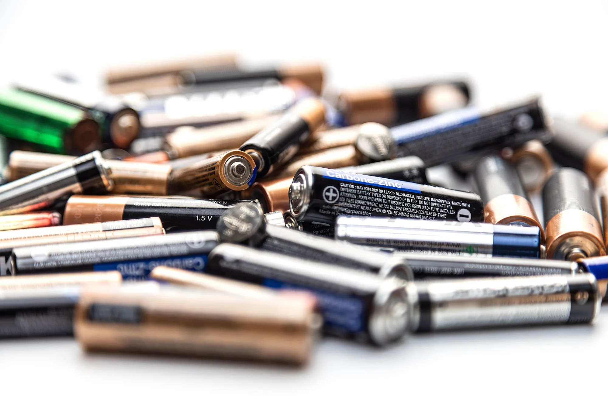Assorted used batteries collected for workplace disposal