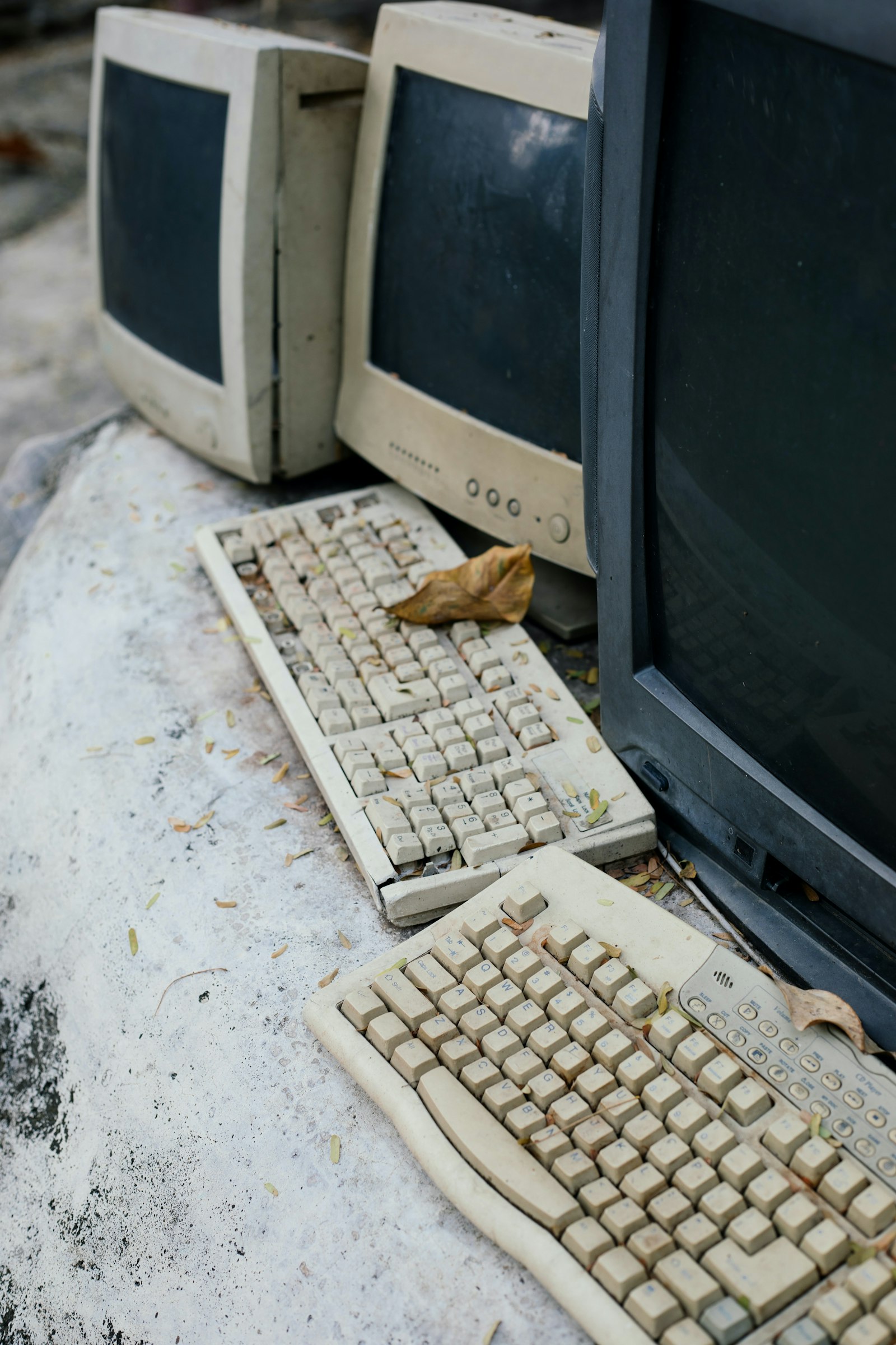 Redundant desktop computers and monitors awaiting collection