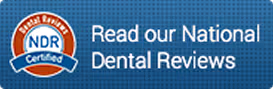 NDR Certified badge next to text reading Read our National Dental Reviews on blue textured background.
