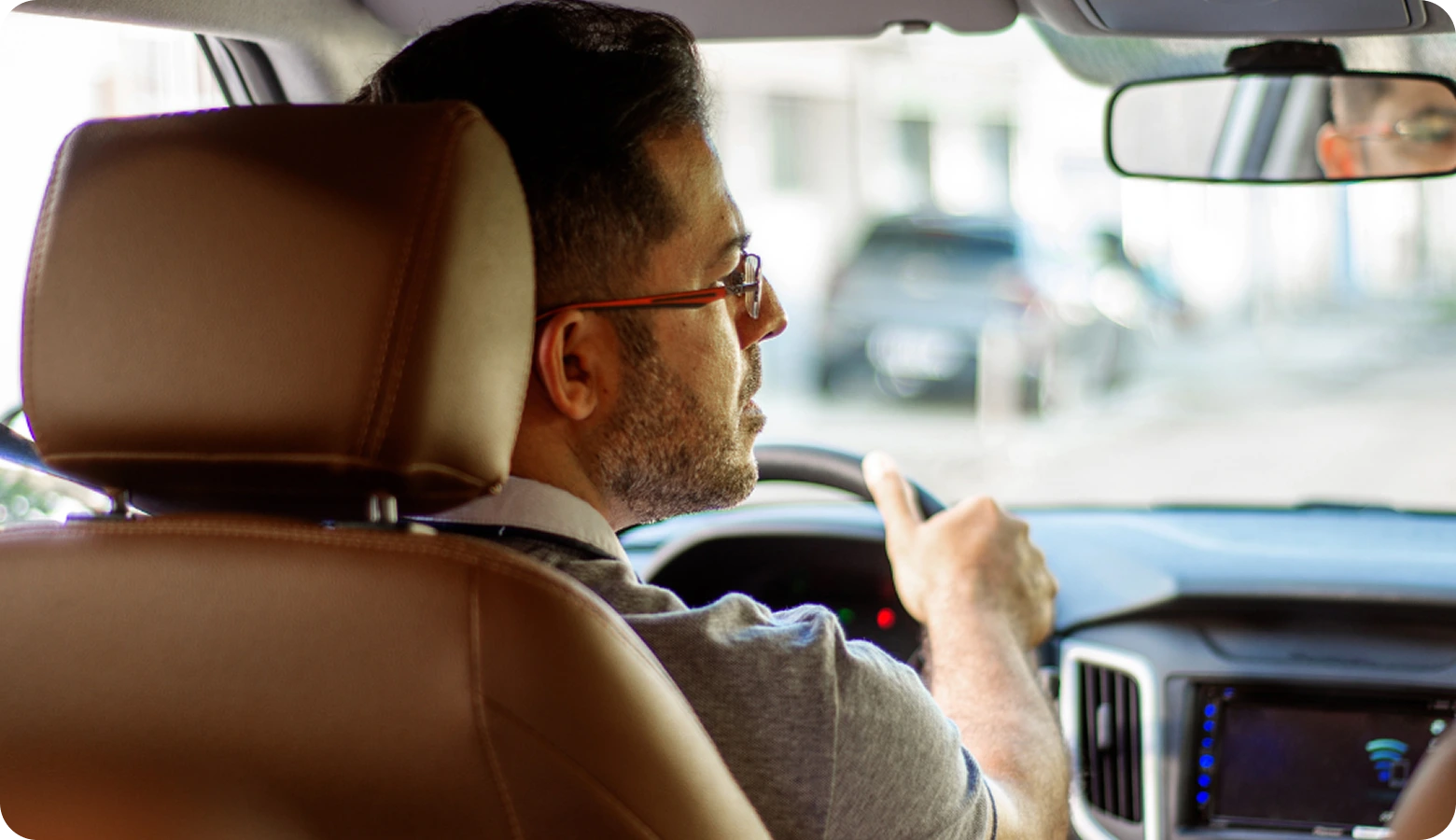 Taxi driver with his clients