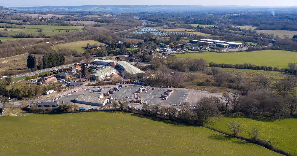 Aerial satellite view showing a rural area with roads M20, A20, A27, and M26; a dashed rectangle highlights a site location near the center.