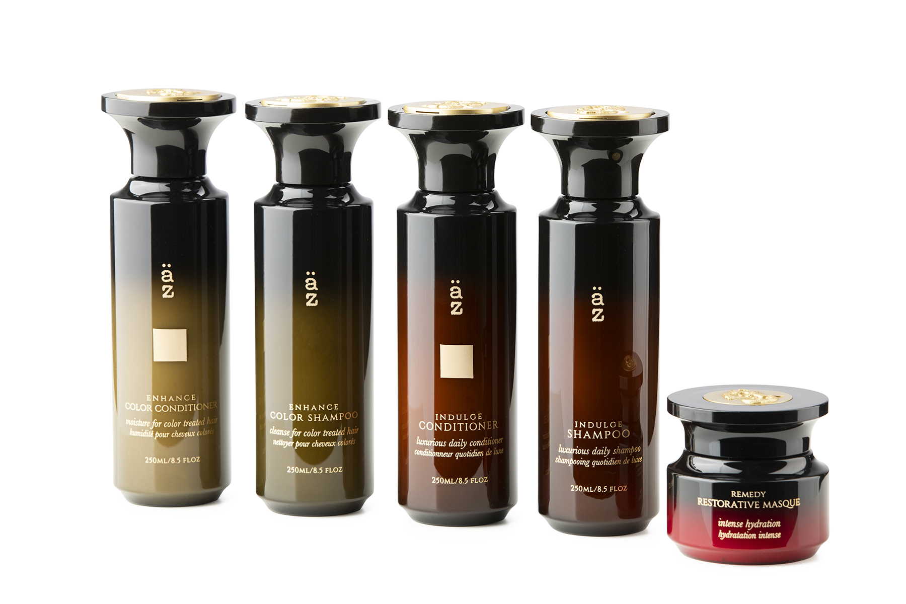 En rekke hårprodukter står på rad på en hvitbakgrunn