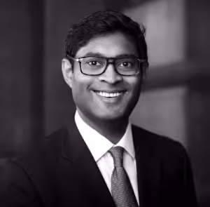 A black and white photograph of Trevor Withane