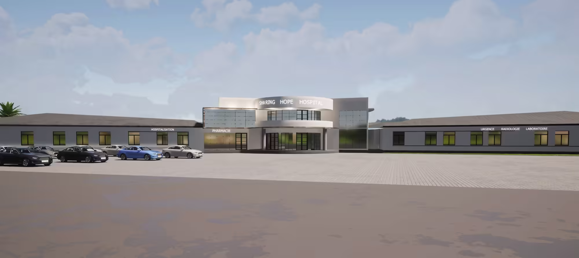 Modern hospital building with parking lot and cars in front under a partly cloudy sky.