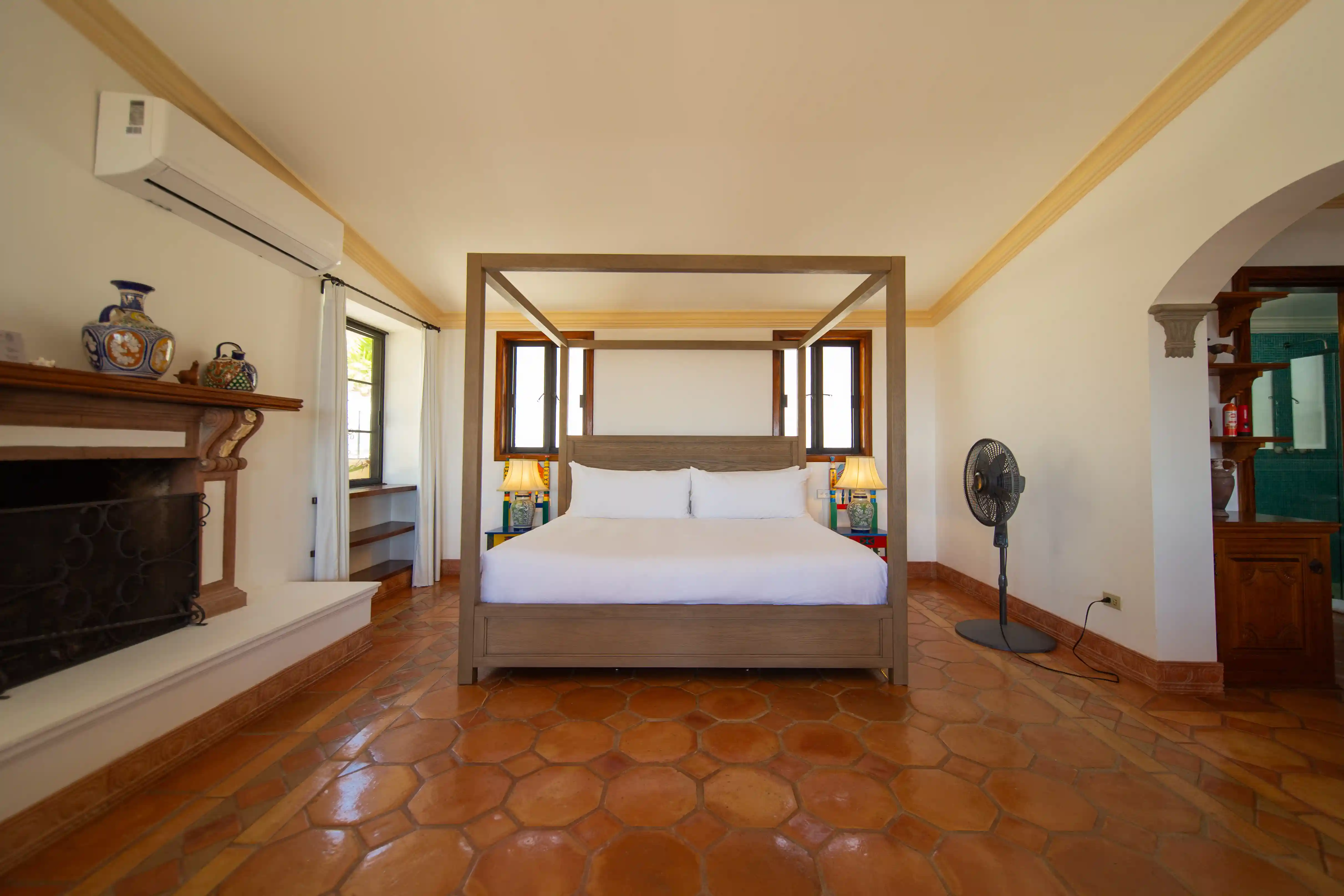 A serene king suite featuring a shared terrace with garden and ocean views.