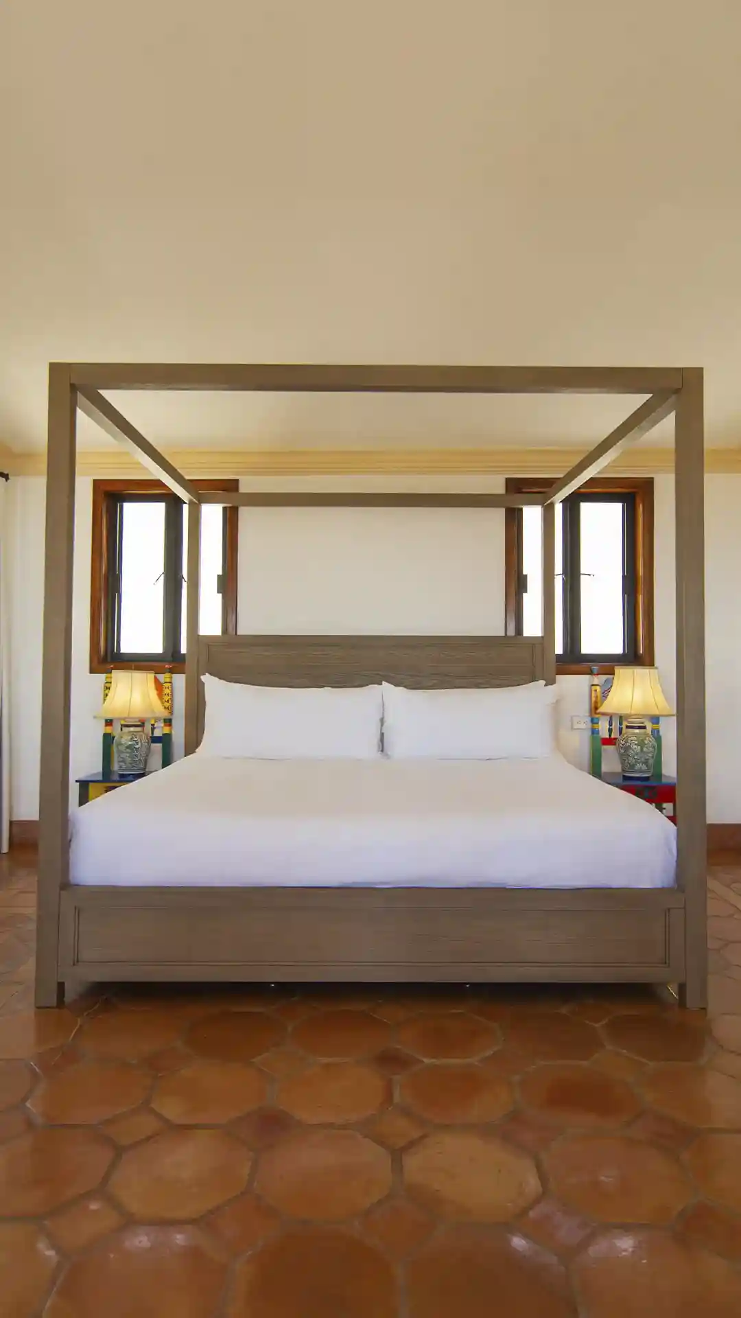 A serene king suite featuring a shared terrace with garden and ocean views.