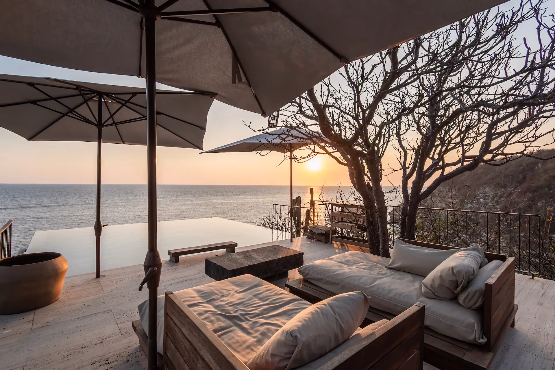 Luxury terrace at sunset at La Valise Mazunte Hotel, featuring panoramic Pacific Ocean views in Mexico.