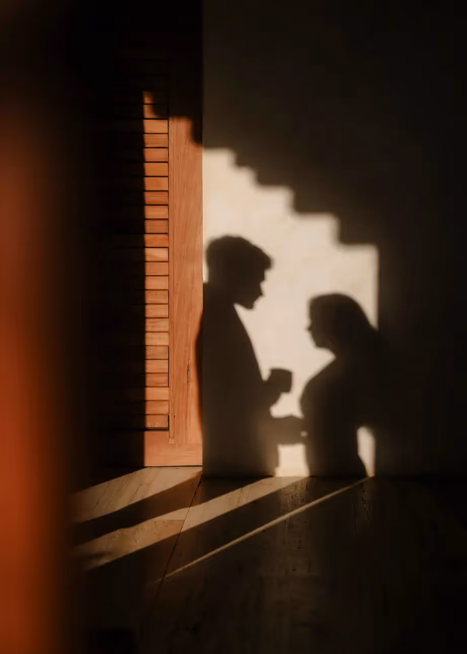 Silhouette of a couple sharing an intimate sunset moment inside a room at La Valise Mazunte Hotel.