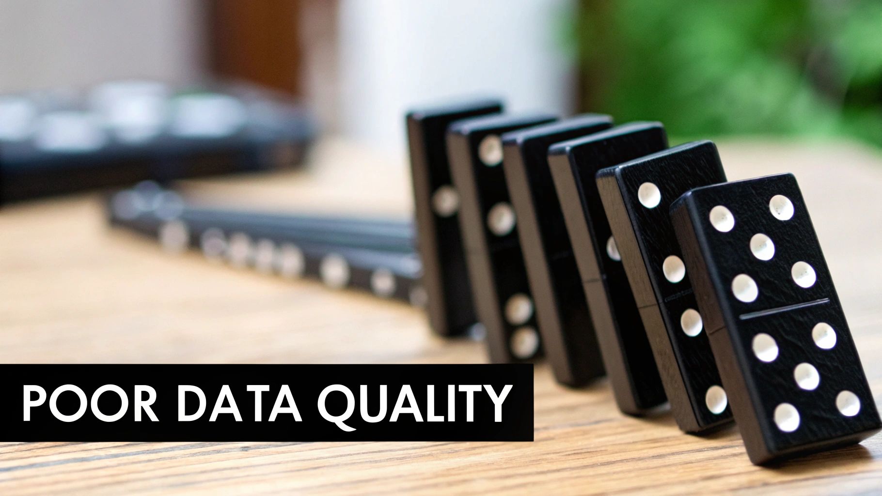 Dominoes falling in a line, symbolizing the chain reaction caused by a single data error