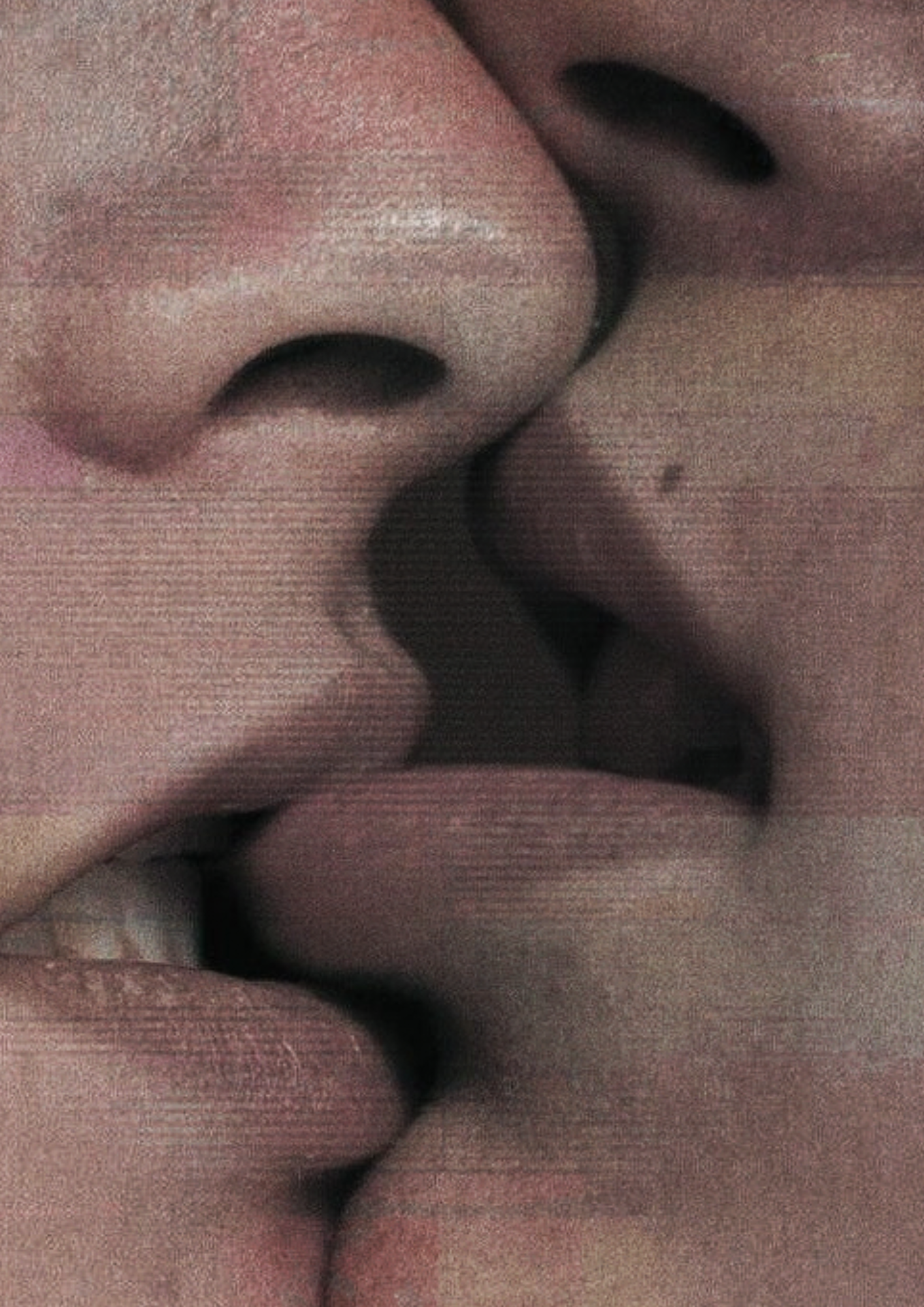 Two people kissing, with one of the participants biting the others lip.