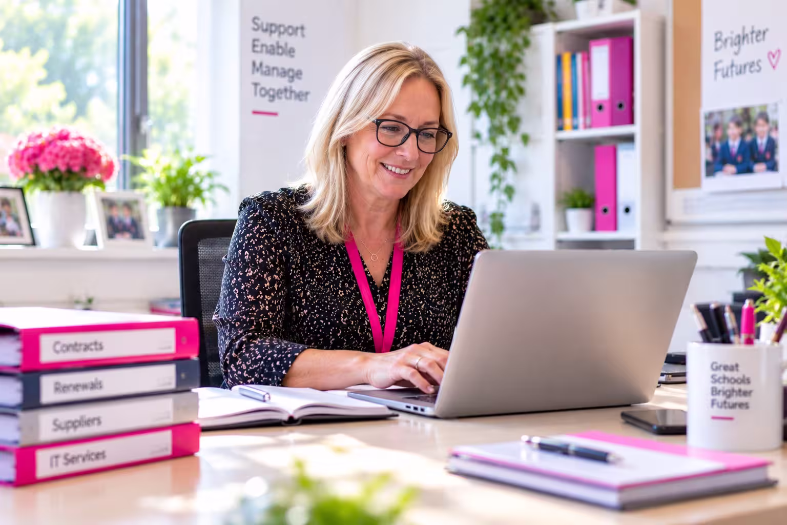 A designated safeguarding lead and IT manager reviewing a monitoring report together