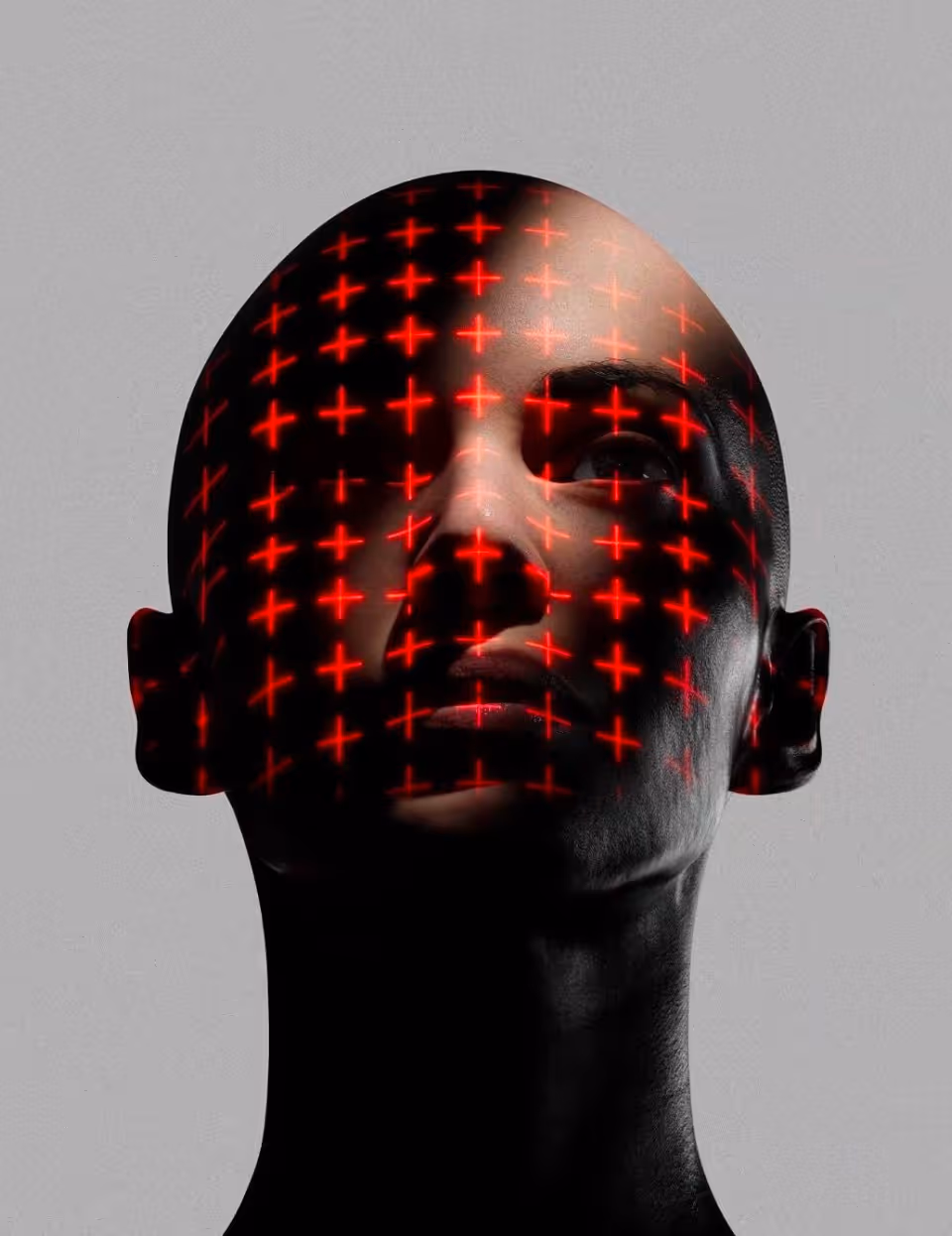 Abstract dark portrait overlaid with a red grid, evoking sound mapping and acoustics.