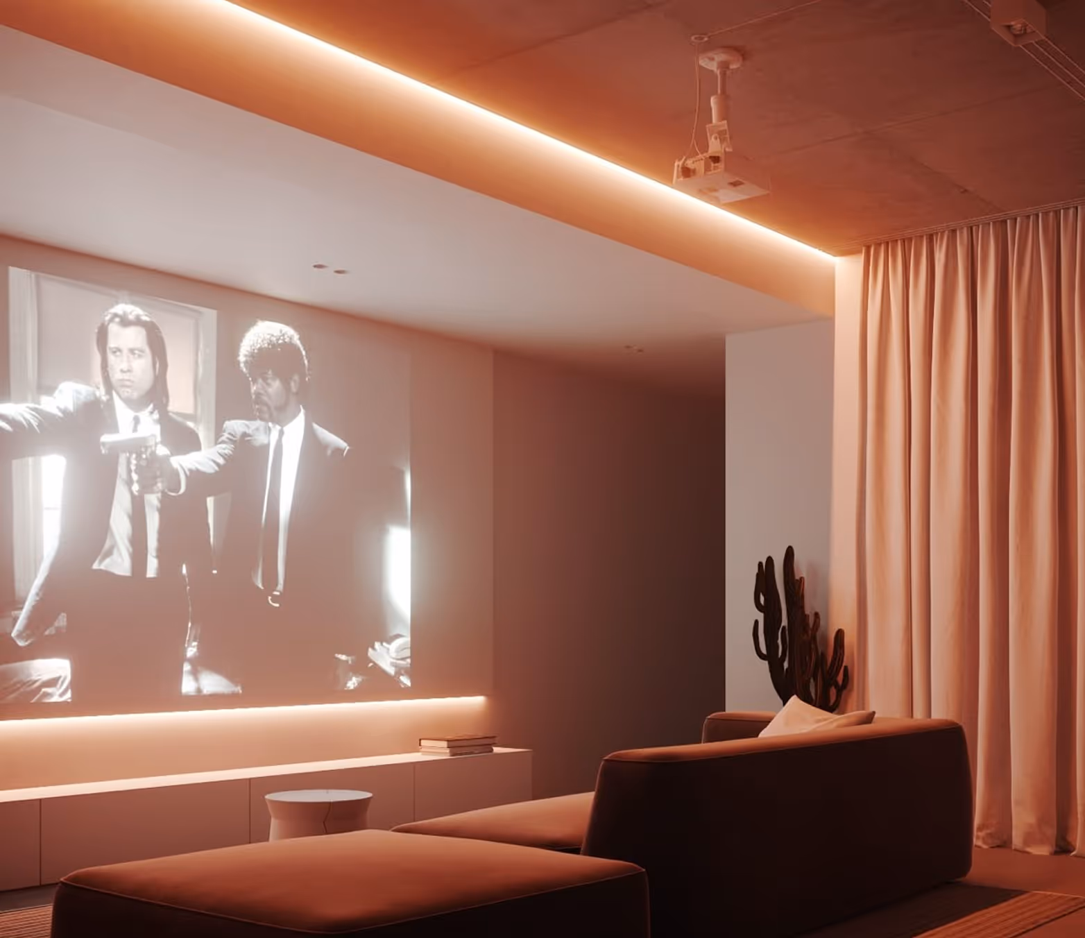 Cozy home theatre with acoustic ceiling, projector, and Pulp Fiction on screen.