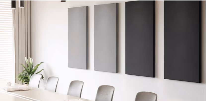 Grey acoustic wall panels arranged on a wood-clad feature wall.