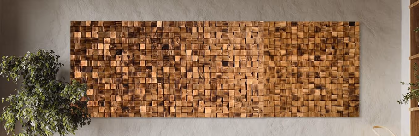 Wood-block three-dimensional acoustic diffuser panel mounted on a plaster wall.
