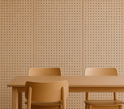 Wood perforated acoustic wall panels behind a dining table and chairs.