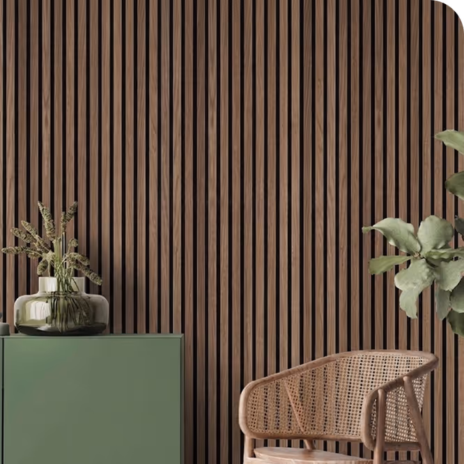 Living room featuring a walnut acoustic wood slat wall, green sideboard, vase and rattan accent chair.