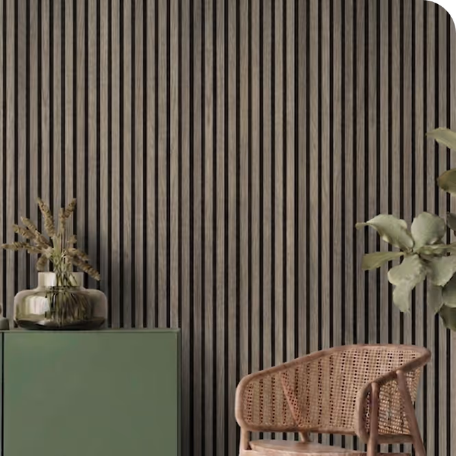 Living room with a grey-brown walnut acoustic wood slat wall, green sideboard and rattan chair.