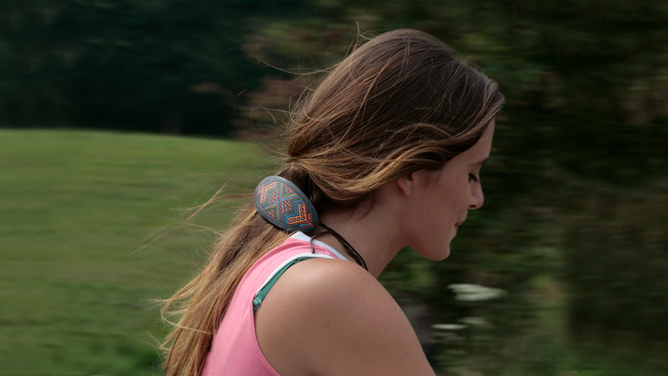 Brunette Man Standing Behind Other Man in Studio