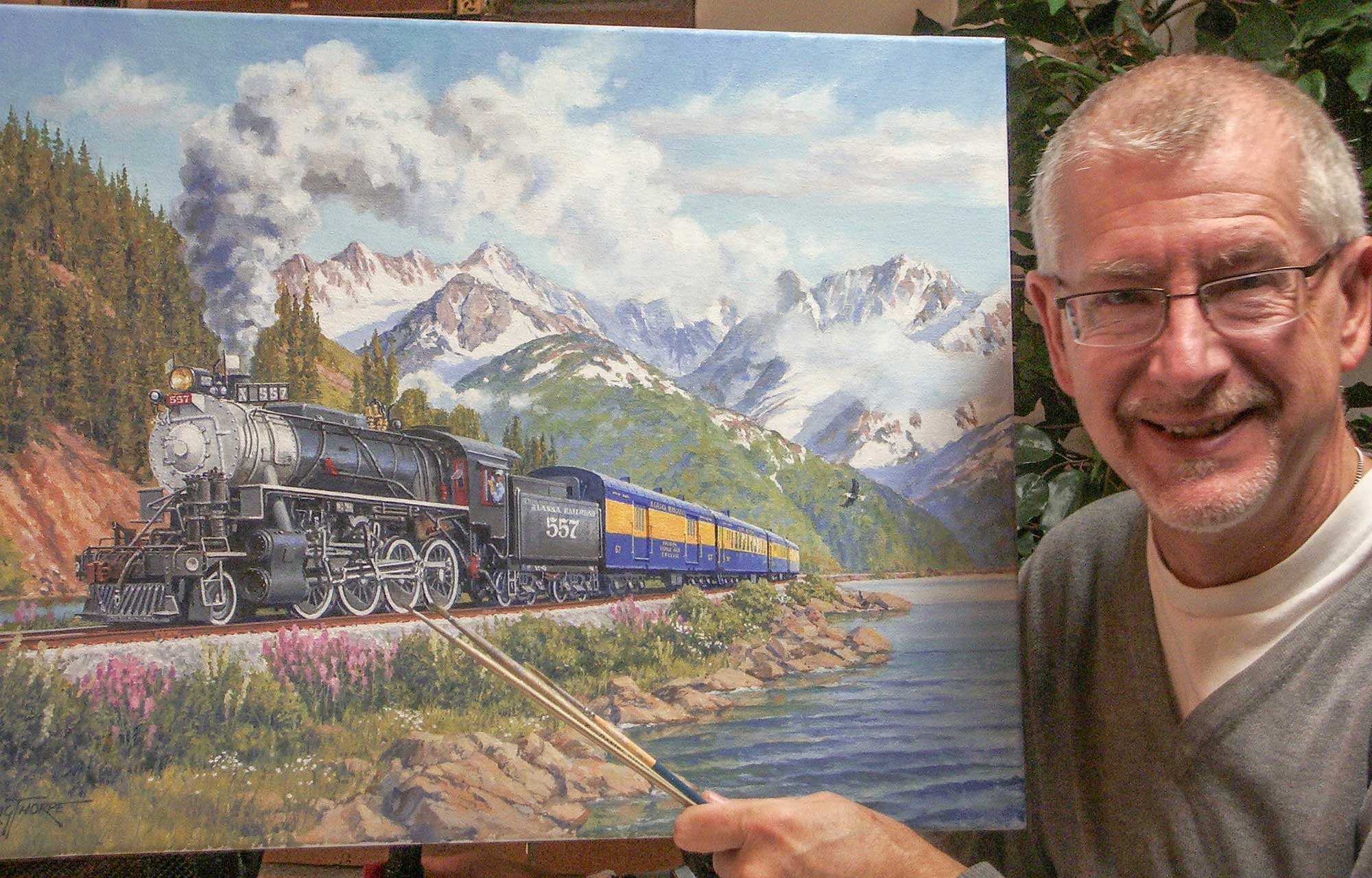 The artist J. Craig Thorpe of Bellevue, Washington, poses with one of his works of art.