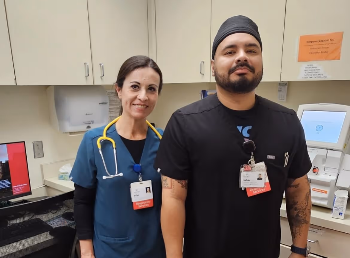 Healthcare workers posing or collaborating during a hospital event.