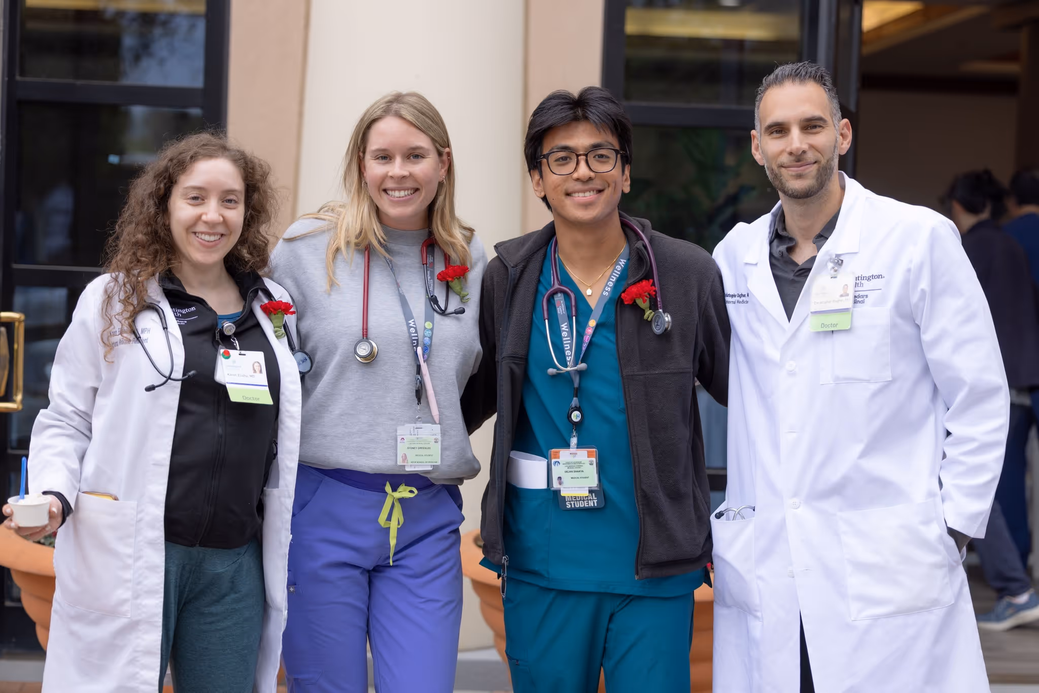 Hospital team members together in a hallway or work area.
