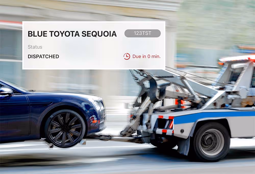 Tow truck towing a blue car with overlay showing dispatched status and due in 0 minutes.