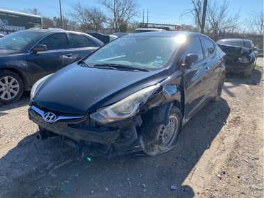 Unclaimed 2016 Hyundai Elantra with a damaged front end parked in an impound lot
