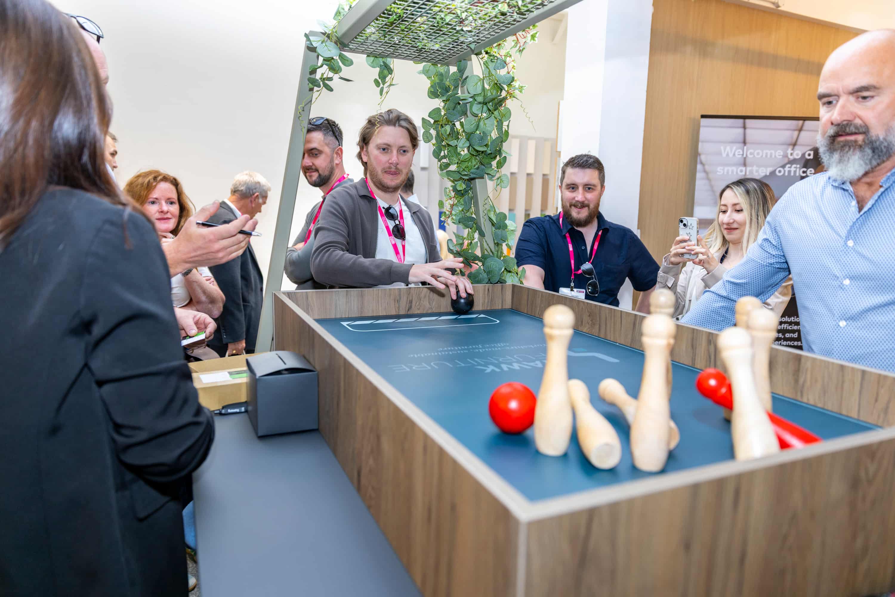 A custom brand-specific game of bowling, using Hawk Furniture's Apex table as the main element.