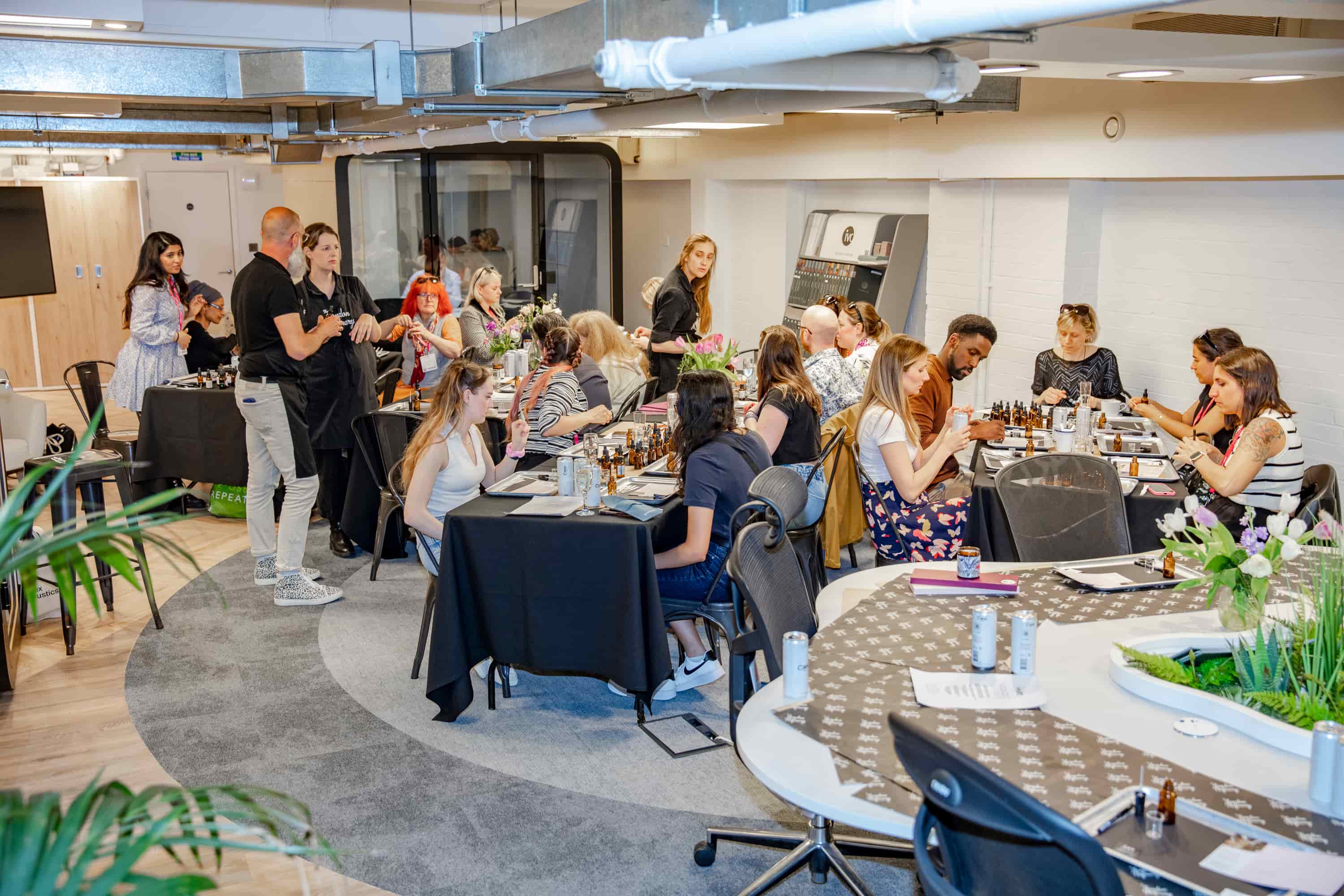 An image from a previous Select First-ran event showing multiple groups taking part in a DIY fragrance experience.